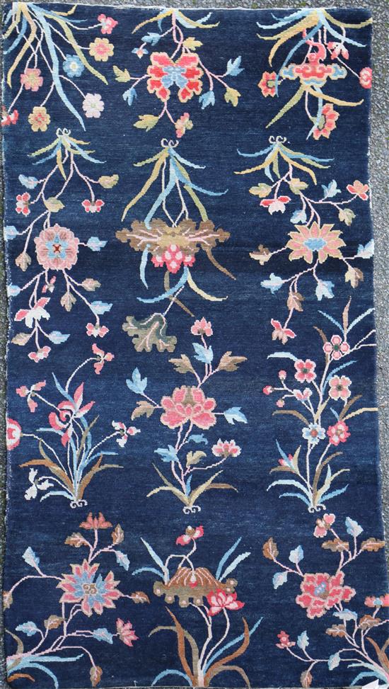 A Tibetan twelve plant rug, 5ft 7in. x 3ft 1in.